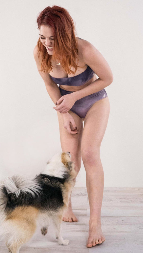 Model playing with Werkshop's mascot puppy, Stella!