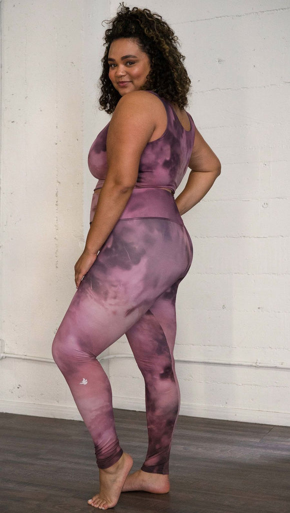 left side view of model wearing rose quartz stone design printed full length leggings