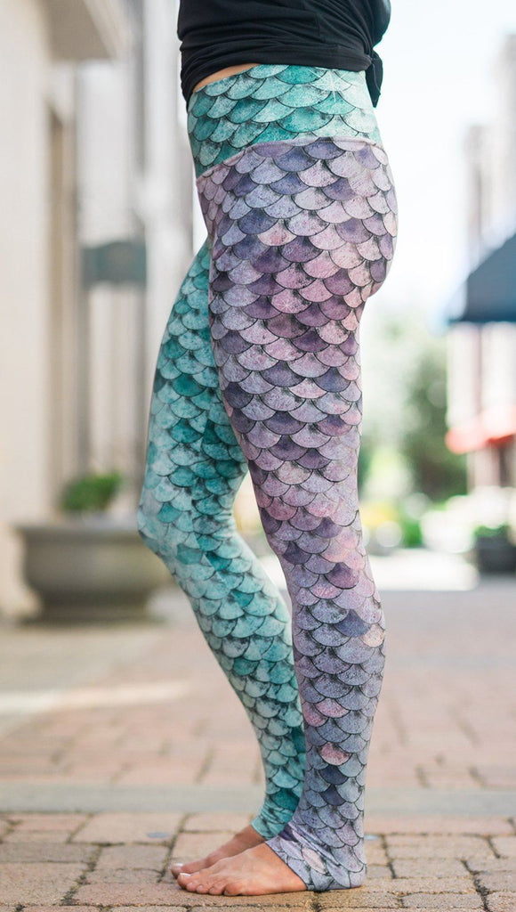 closeup left side view of model wearing mermaid scales design printed full length leggings