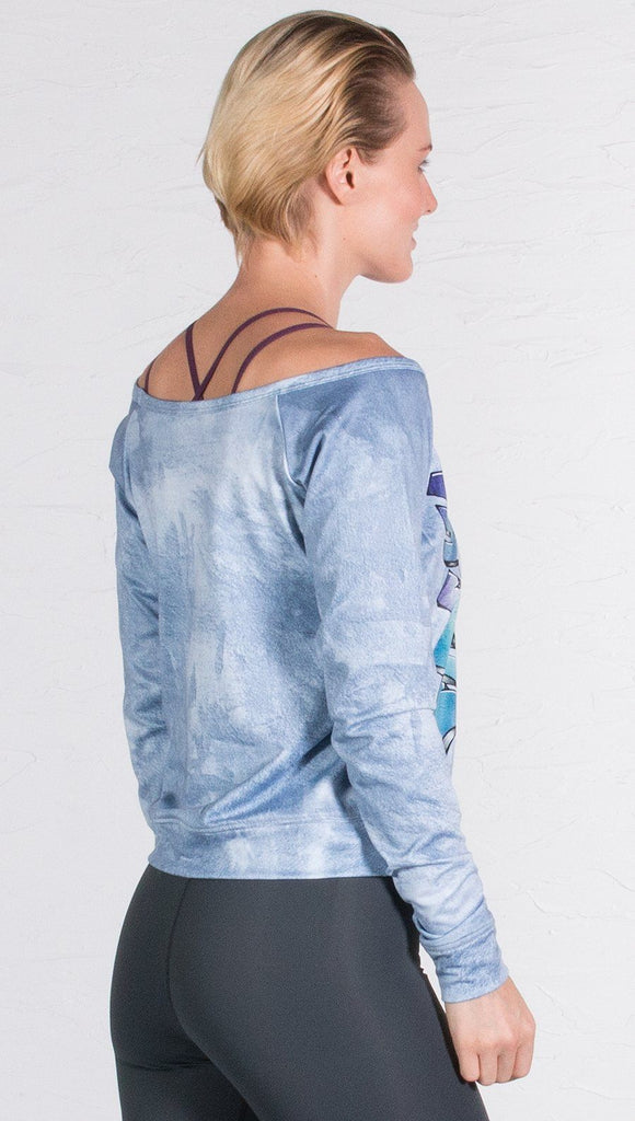 back view of model wearing graffiti design pullover 