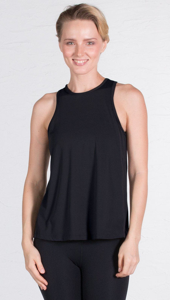 closeup front view of model wearing black tie back sports tank top