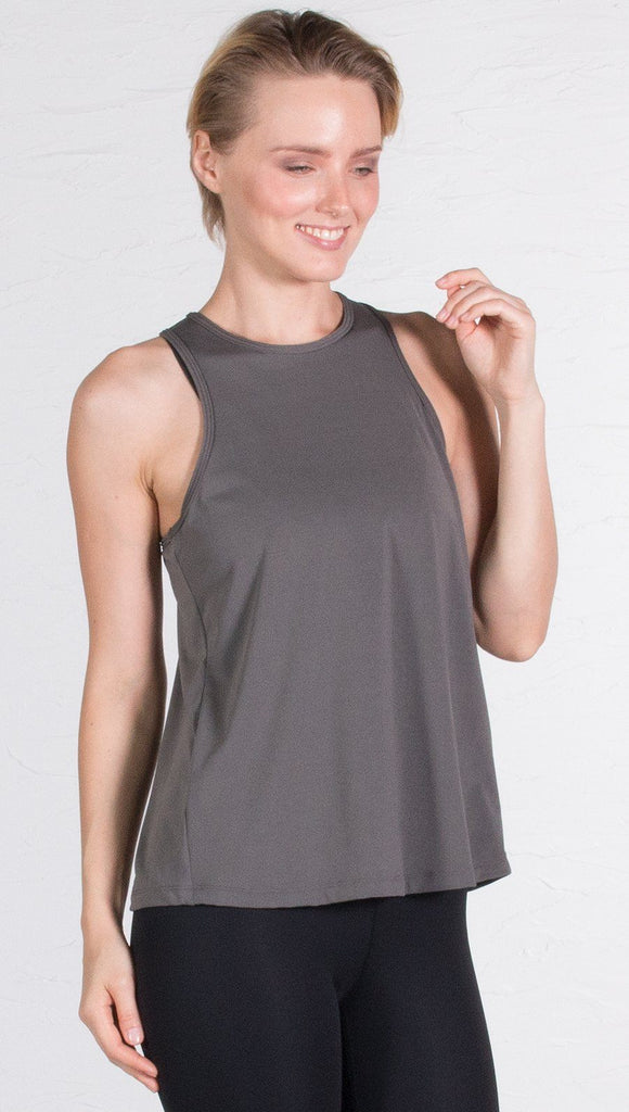 closeup front view of model wearing gray tie back sports tank top