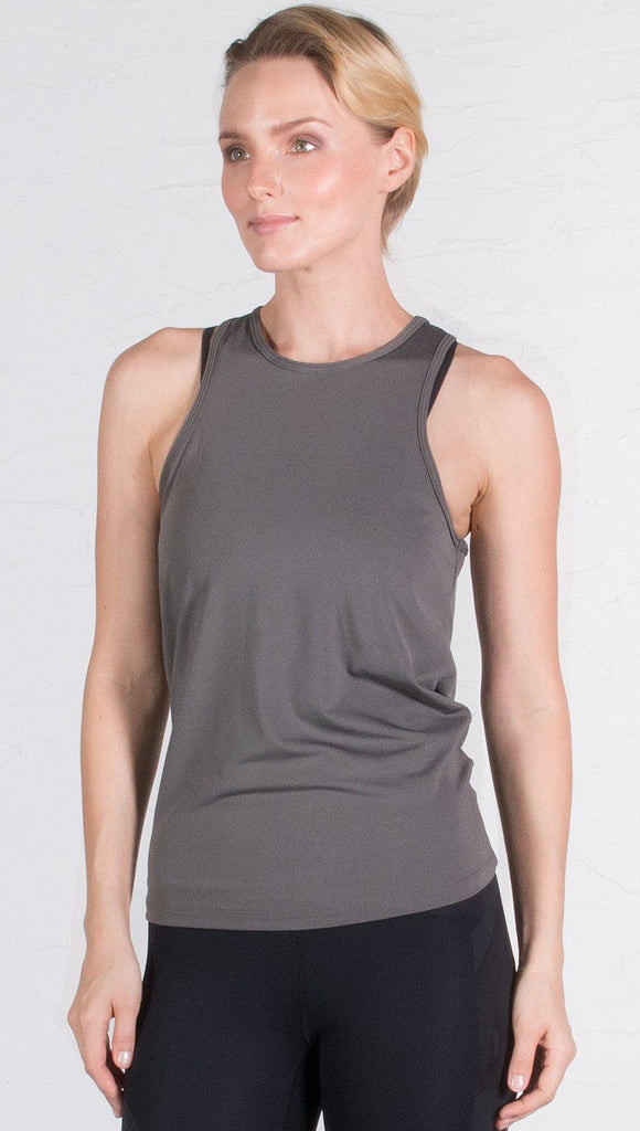 closeup front view of model wearing gray tie back sports tank top
