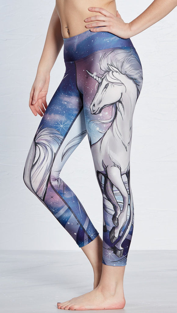 closeup left side view of model wearing unicorn design printed capri leggings