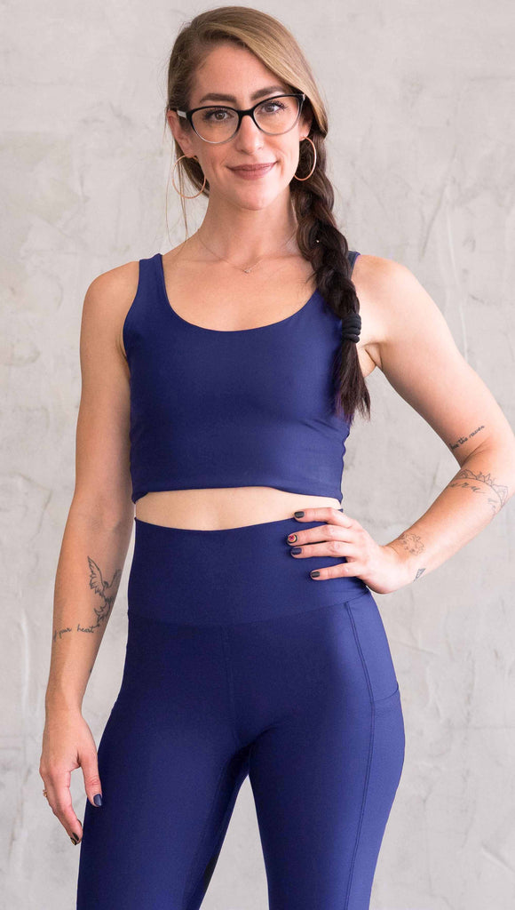 model wearing WERKSHOP four way with the X in the back and royal blue showing