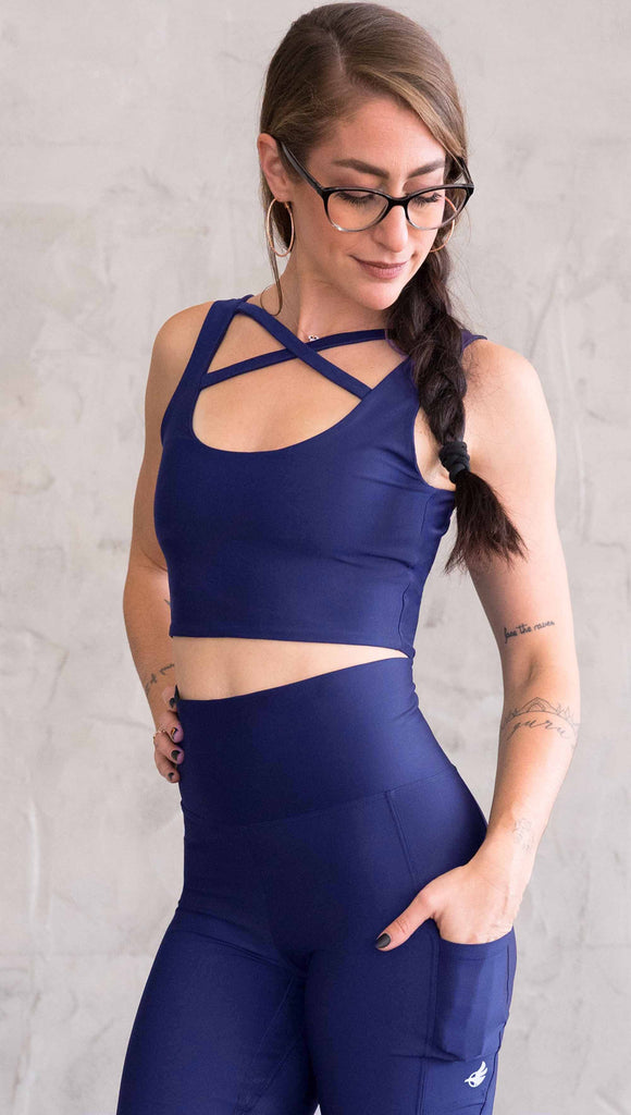 model wearing WERKSHOP four way with the X in the front and royal blue showing