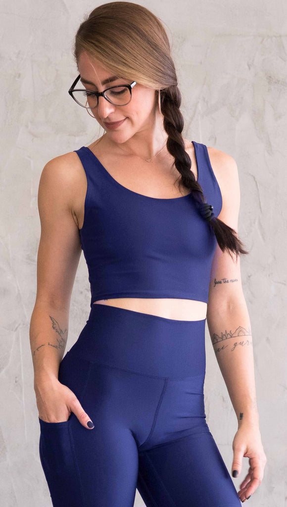 model wearing WERKSHOP four way with the X in the back and royal blue showing