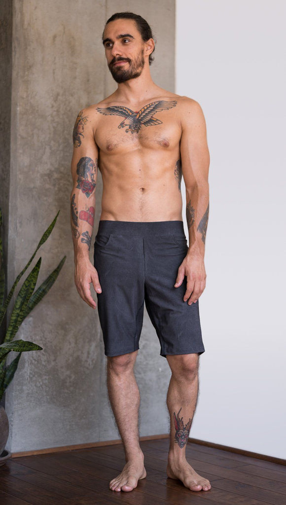 front view of model wearing charcoal black printed mens performance shorts