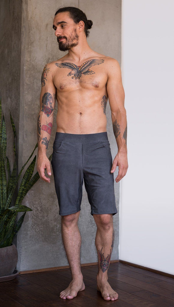front view of model wearing gray mens performance shorts