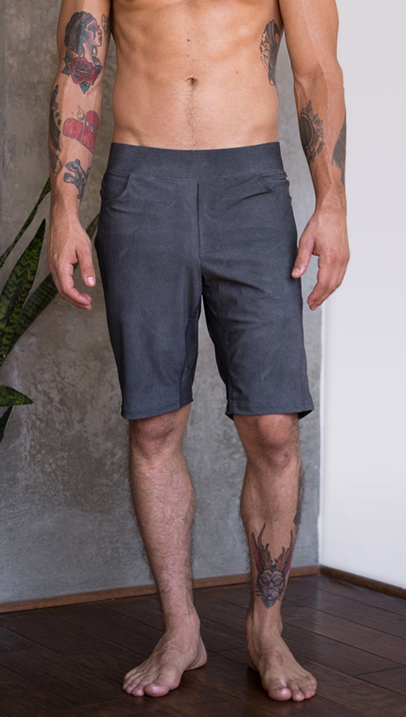 close up front view of model wearing gray mens performance shorts
