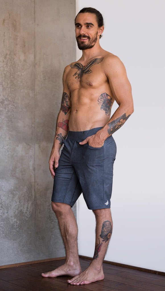 left side view of model wearing slate mens performance shorts