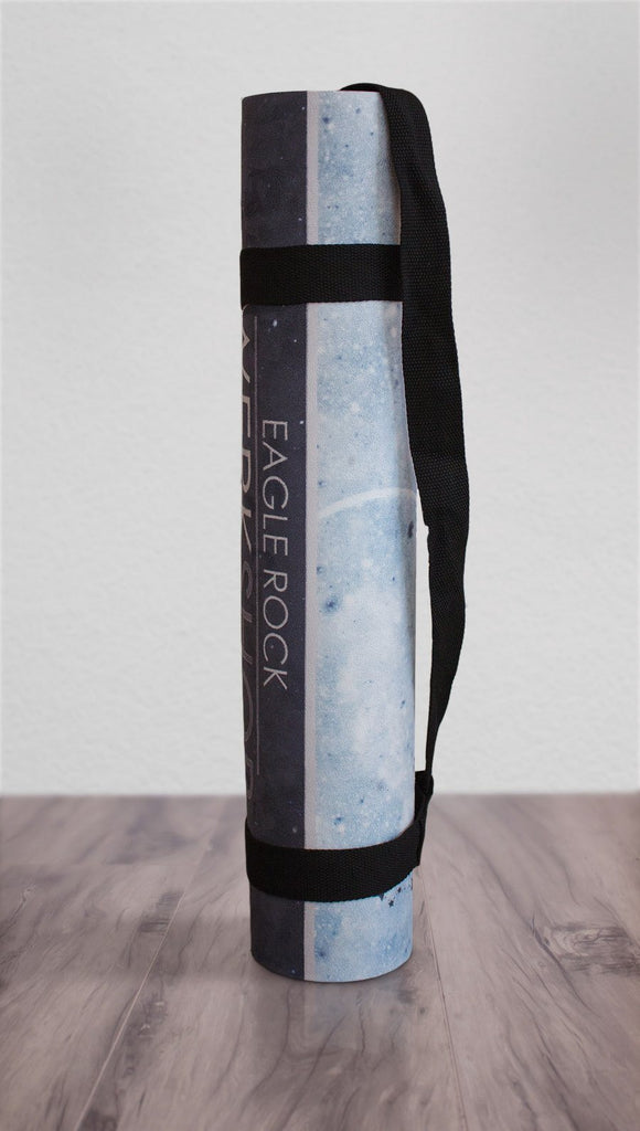 view of rolled up moon cycle themed yoga mat