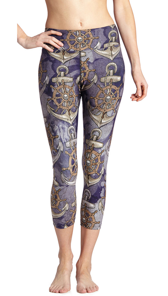 Model wearing WERKSHOP Anchors Leggings. The leggings are printed with hand drawn and distressed pirate inspired artwork with anchorw, little skulls and a shop steering wheel.