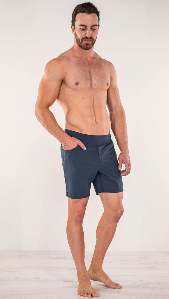 Front view of model wearing black men's performance shorts