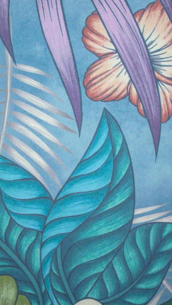 closeup view of yoga mat design with tropical floral design and blue background