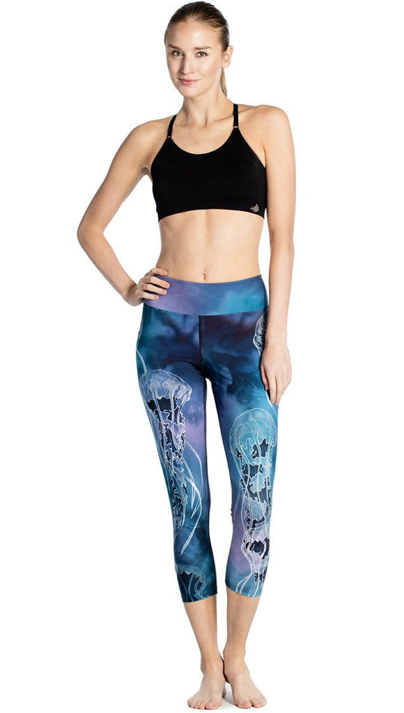 front view of model wearing jellyfish themed printed capri leggings