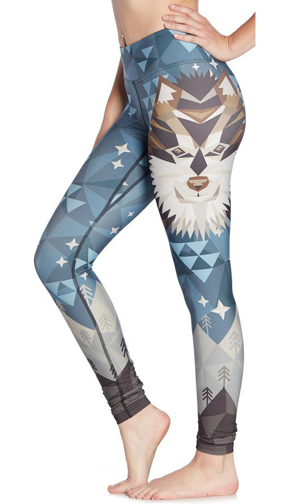 close up left side view of model wearing wolf / dog themed printed full length leggings
