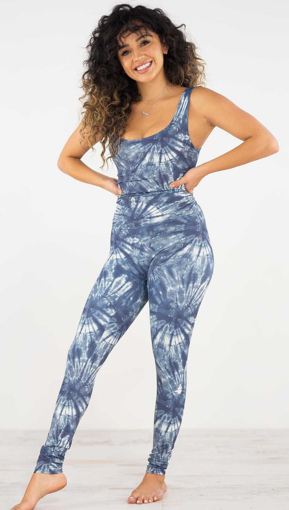 Front view of model wearing the indigo spiral athleisure leggings. They are in a indigo color with white tie dye spirals throughout.