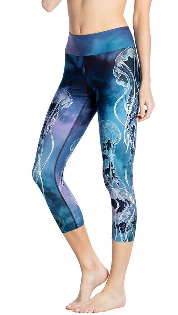 close up front view of model wearing jellyfish themed printed capri leggings