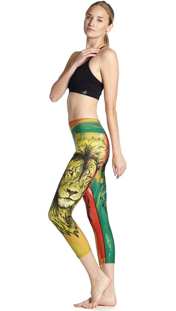eft side view of model wearing rasta lion themed printed capri leggings