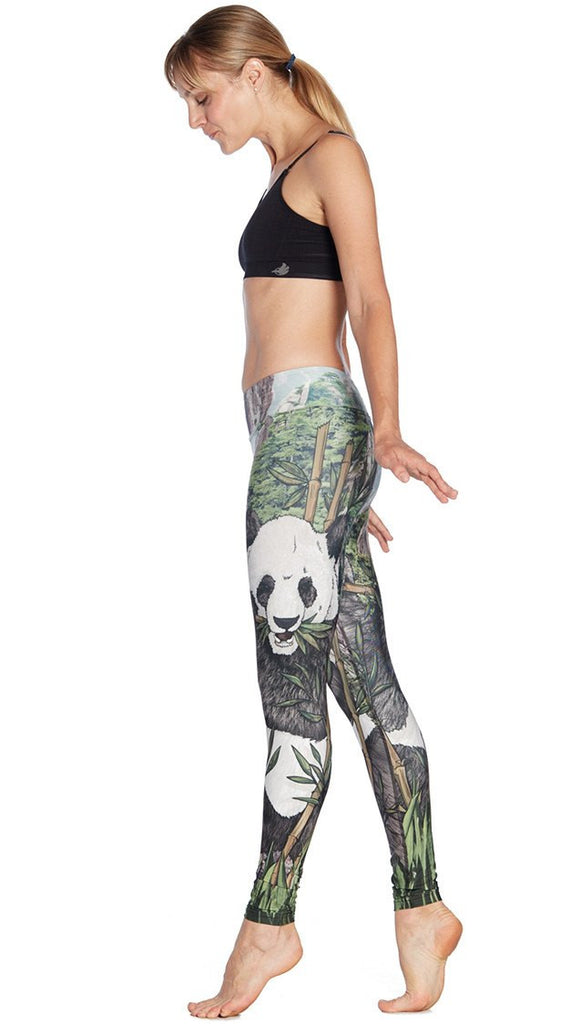 left side view of model wearing panda themed printed full length leggings