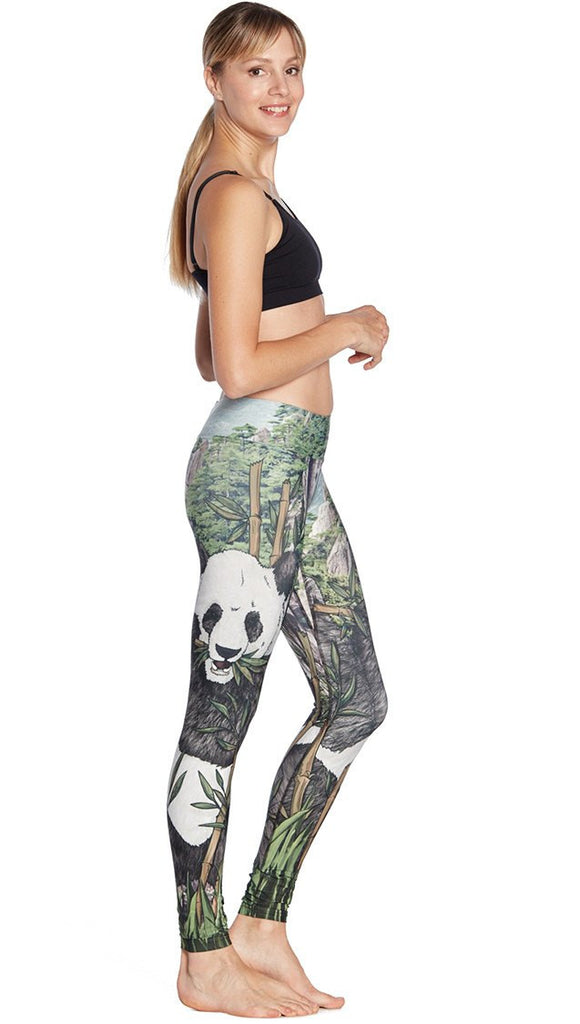 right side view of model wearing panda themed printed full length leggings