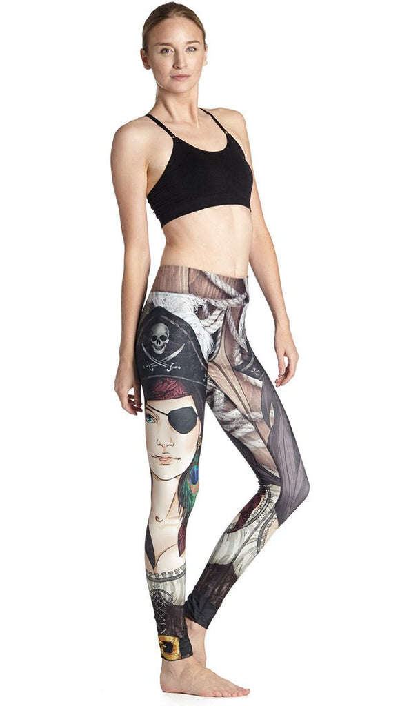 right side view of model wearing pirate girl themed printed full length leggings