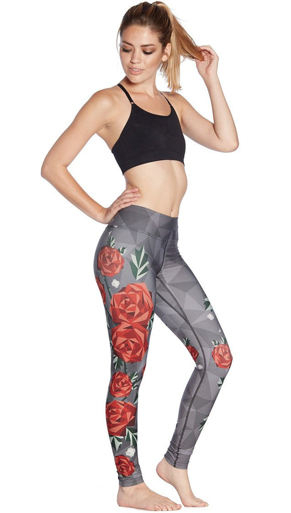right side view of model wearing polygon roses themed printed full length leggings