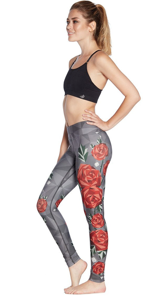 left side view of model wearing polygon roses themed printed full length leggings
