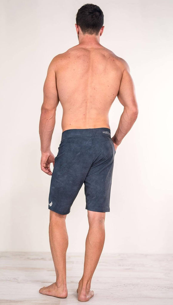 Back view of model wearing slate men's performance shorts