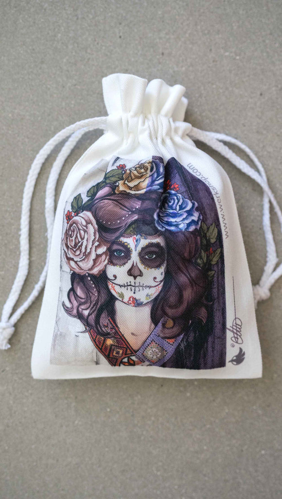WERKSHOP Sugar Skull Mashup Canvas drawcord pouch (comes free with matching puzzle!). The artwork celebrates Dia De Los Muertos with a drawing of a girl wearing sugarskull makeup surrounded by a wreath of roses.