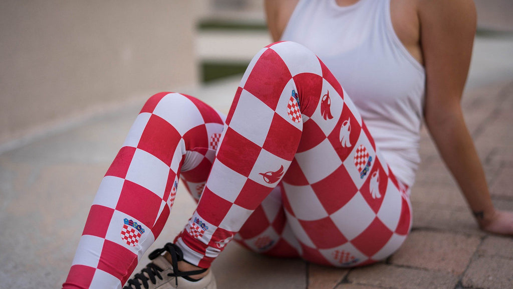 closeup view of model sitting wearing croatian checkered themed full length leggings